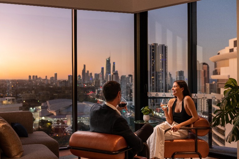 A couple in a hotel balcony.