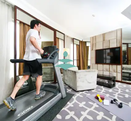 Man on a cardio machine in a Dorsett Hotel room.