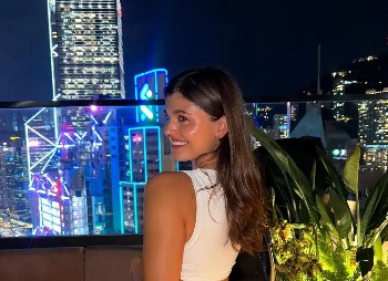 Dorsett Hotel guest exploring Hong Kong at a rooftop bar