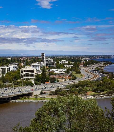 Aerial view of buildings, roads and greeneries of Perth.