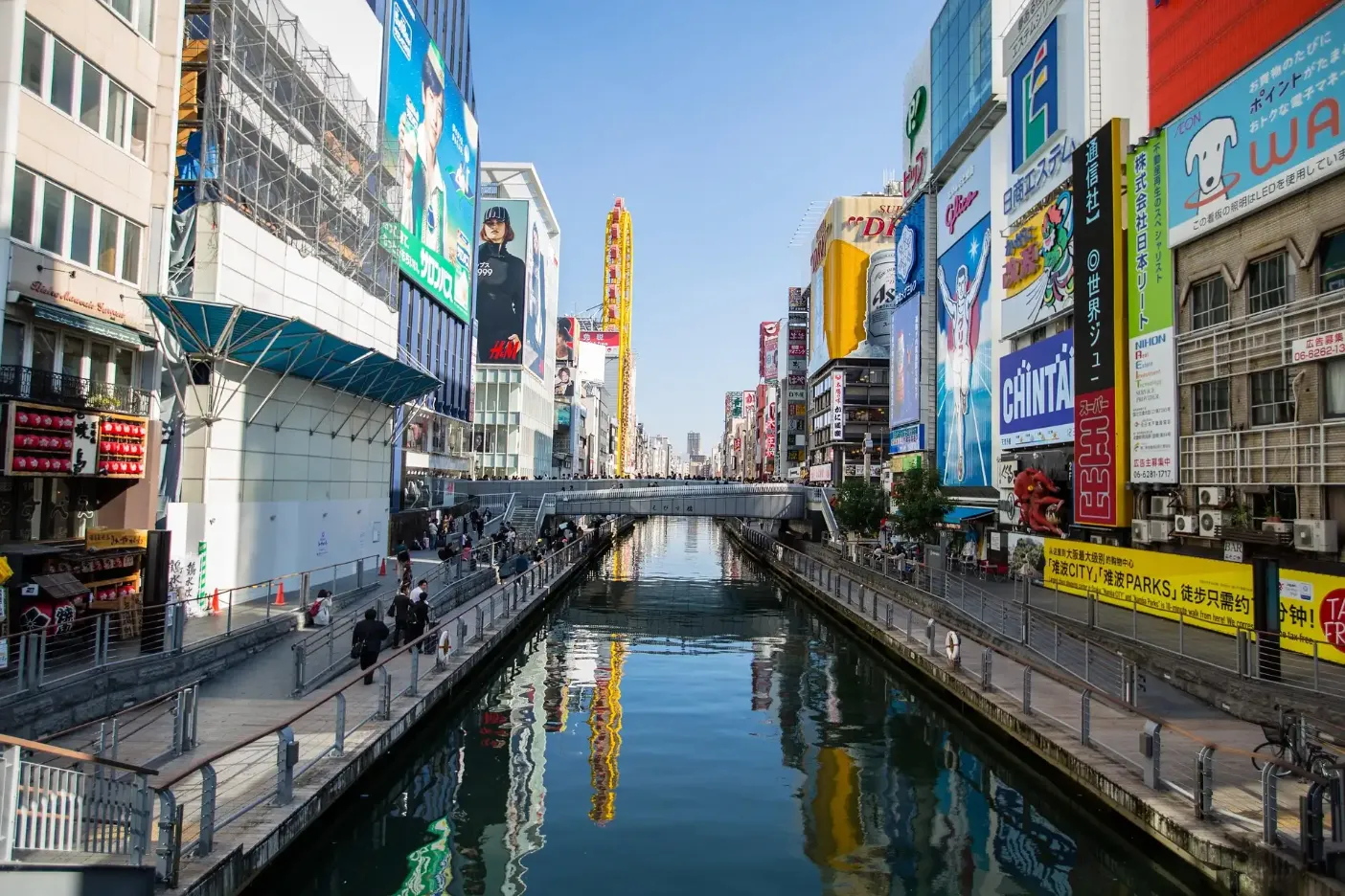 3D render of Osaka City with the Dotonbori Canal lined with colorful buildings