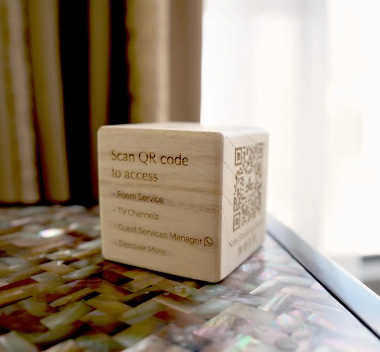 QR code for all services crafted on a wooden box.