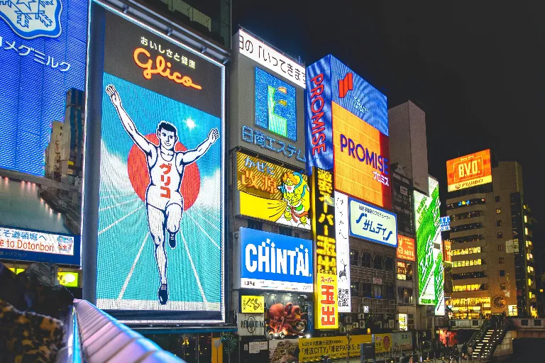 3D render of neon-lit streets and colorful billboards at Dotonbori Osaka