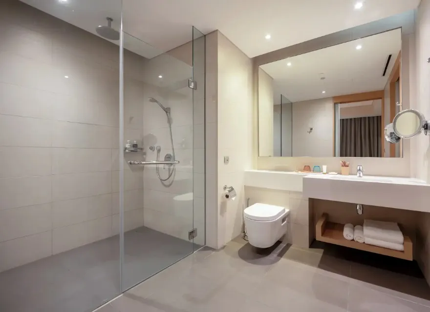 Show, toilet and vanity in Deluxe Room Bathroom