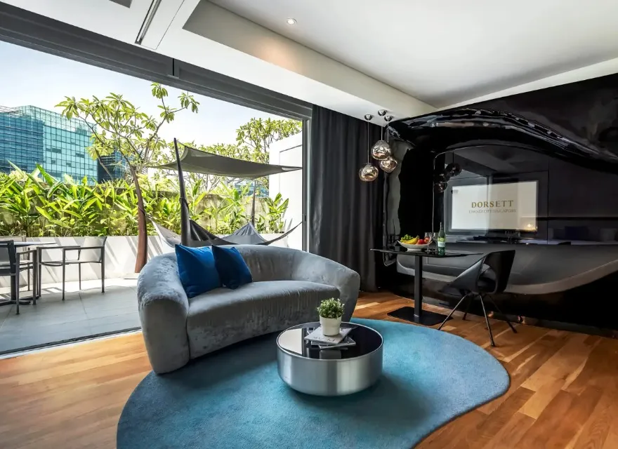 Settee, work desk and TV in the Executive Terrace at Dorsett Changi.