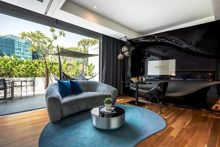 Settee, work desk and TV in the Executive Terrace at Dorsett Changi.