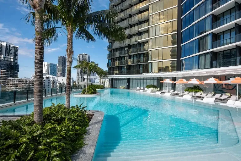 Sunbeds by the outdoor pool at Dorsett Gold Coast