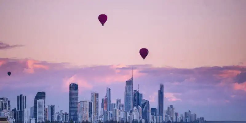 Red balloons floating in the skies in Gold Coast.