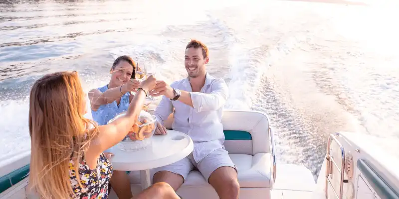 People enjoying a toast in a Yot in Gold Coast.