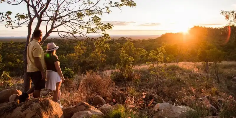 couple looking at outback sunset couple looking at outback sunset