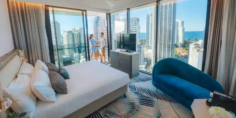 couple on balcony at Dorsett Gold Coast couple on balcony at Dorsett Gold Coast