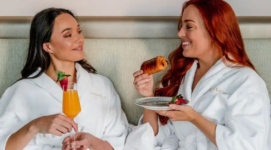 Guests enjoying breakfast in bed Guests enjoying breakfast in bed