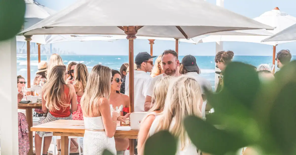 Groups dine in the alfresco area in front of Burleigh beach at Burleigh Pavilion