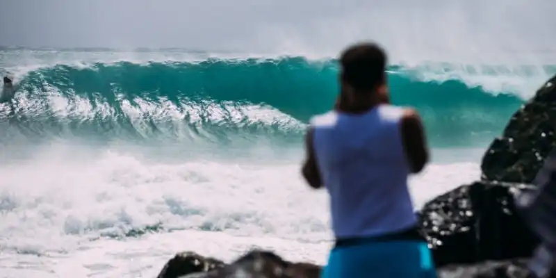 Man watching waves at Coolangatta Beach Man watching waves at Coolangatta Beach