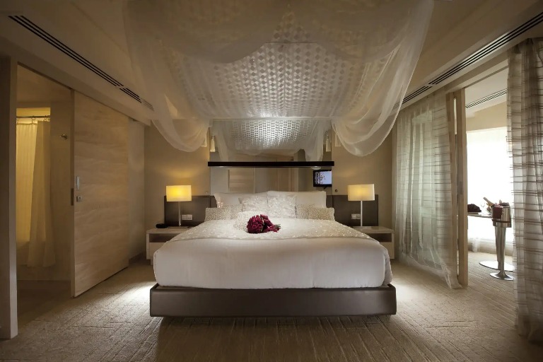 Flower bouquet on a bed in a Dorsett Grand Subang Bedroom.