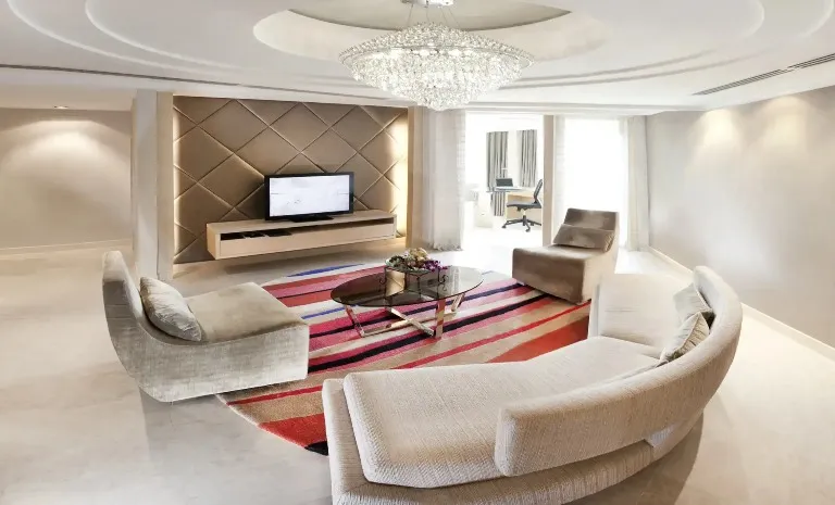 Settee, TV and chandelier in Executive Suite at Dorsett Grand Subang.