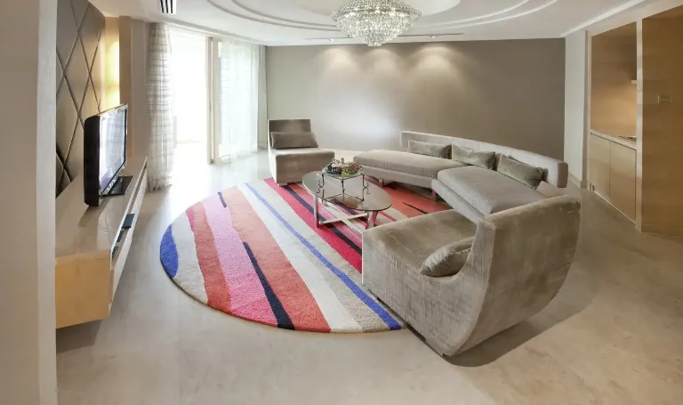 Settee, TV and chandelier in Executive Suite at Dorsett Grand Subang.