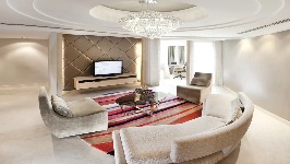 Settee, TV and chandelier in Executive Suite at Dorsett Grand Subang.