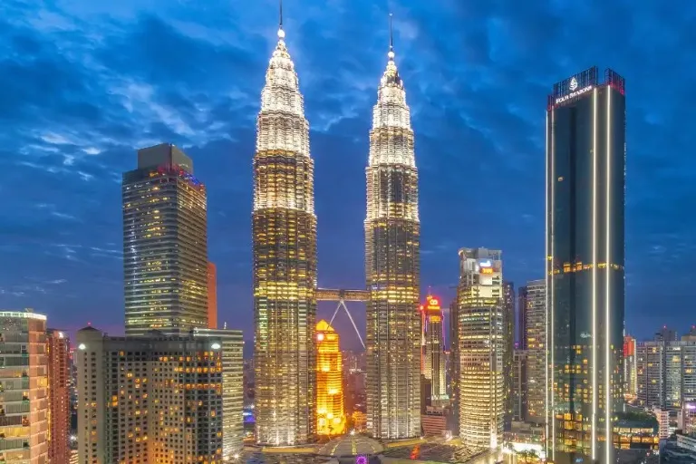 Kuala Lumpur cityscape with vibrant lights.