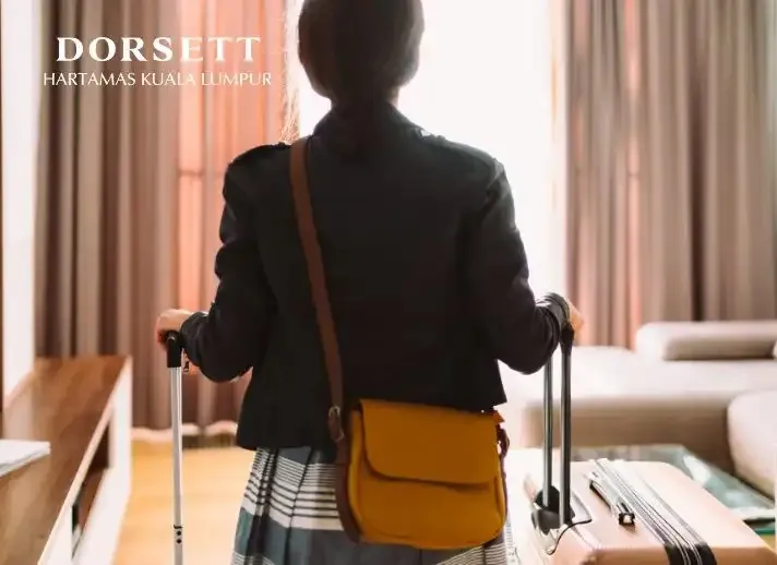 Person entering a Dorsett Hartamas Kuala Lumpur room.