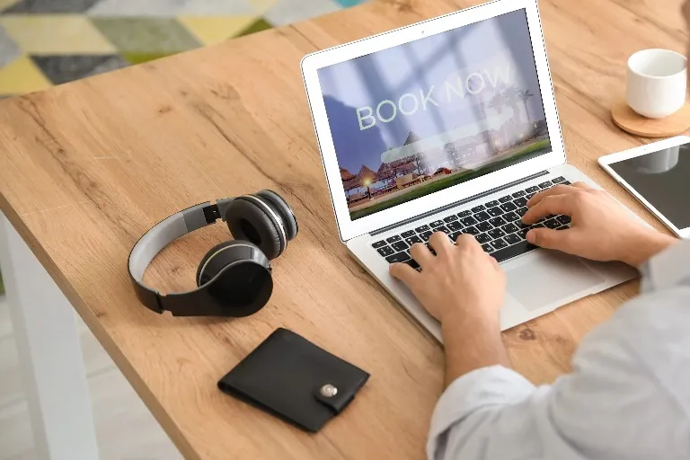 Laptop and headphones on a desk at Dorsett Hartamas Kuala Lumpur.