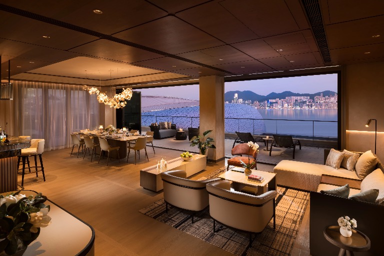 Living room and balcony of a Dorsett Kai Tak Hotel Suite.