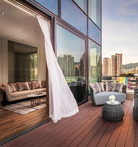 Seating area in the balcony in a Dorsett Kai Tak Hotel Room.