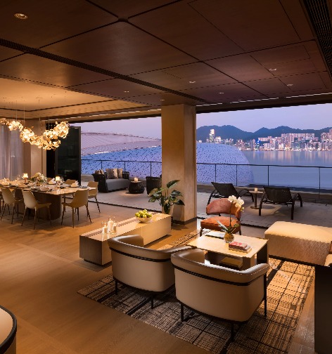 Living room and balcony of a Dorsett Kai Tak Hotel Suite.