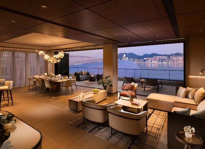 Living room and balcony of a Dorsett Kai Tak Hotel Suite.