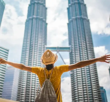 Person looking at the KL Twin Towers.