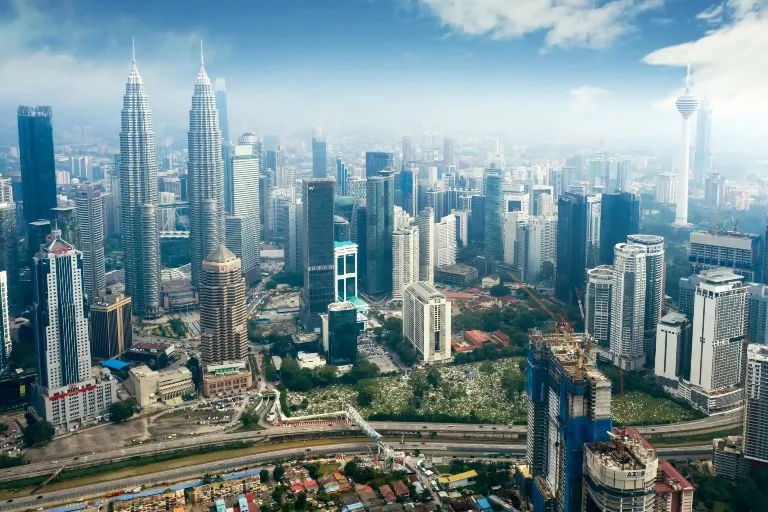 Cityscape of Kuala Lumpur during the day.