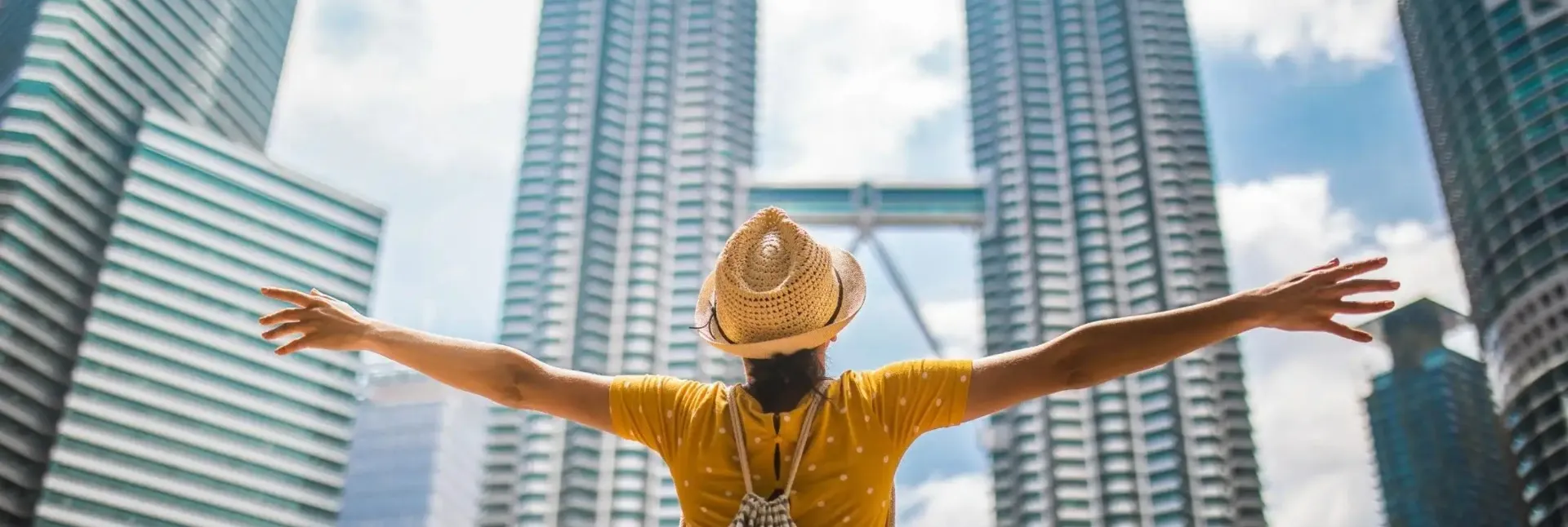 Person looking the Petronas Twin Towers.