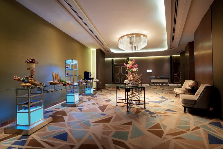 Food station, chandelier and seating at Dorsett Kuala Lumpur.