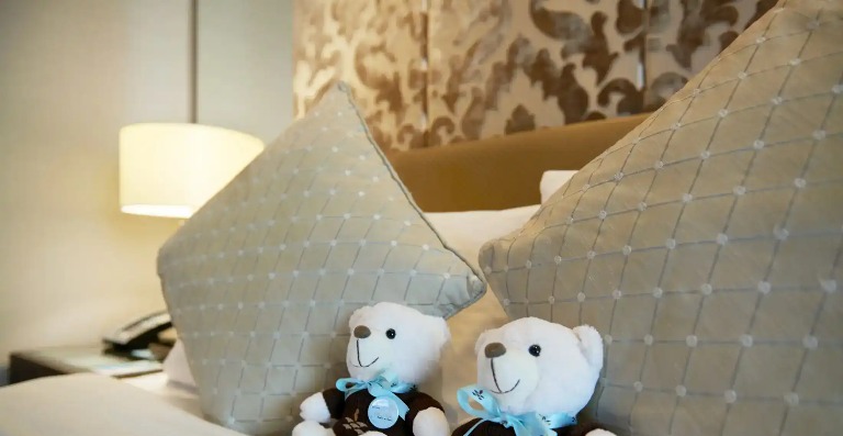 Two soft toys in a Dorsett Kuala Lumpur Bedroom.