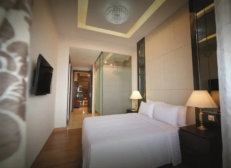 TV by the bed in Dorsett Kuala Lumpur Two Bedroom Premier.