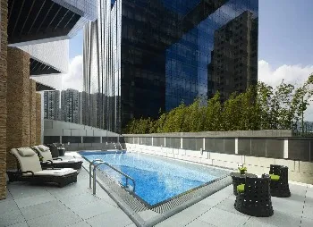 Outdoor pool at Dorsett Kwun Tong during the day.