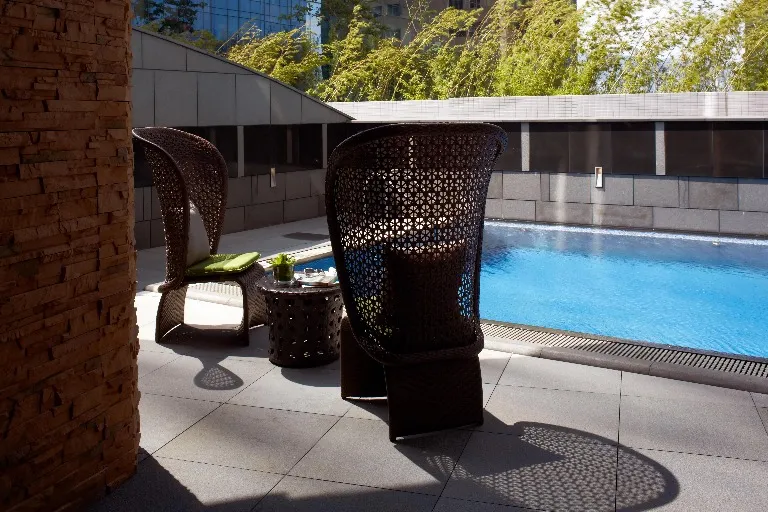 Poolside bistro set at Dorsett Kwun Tong Hotel.