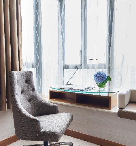 Sofa by the work desk in the Dorsett Kwun Tong Standard Room.