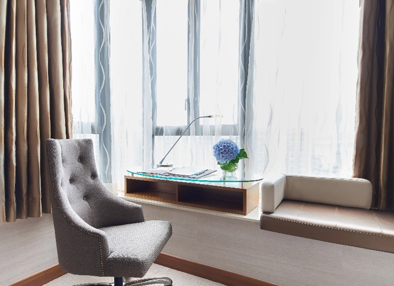 Sofa by the work desk in the Dorsett Kwun Tong Standard Room.