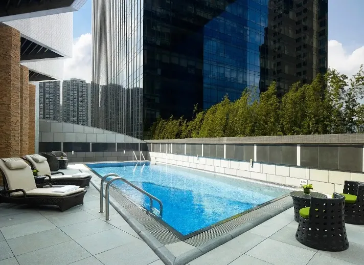 Sunlounges by the outdoor pool at Dorsett Kwun Tong.