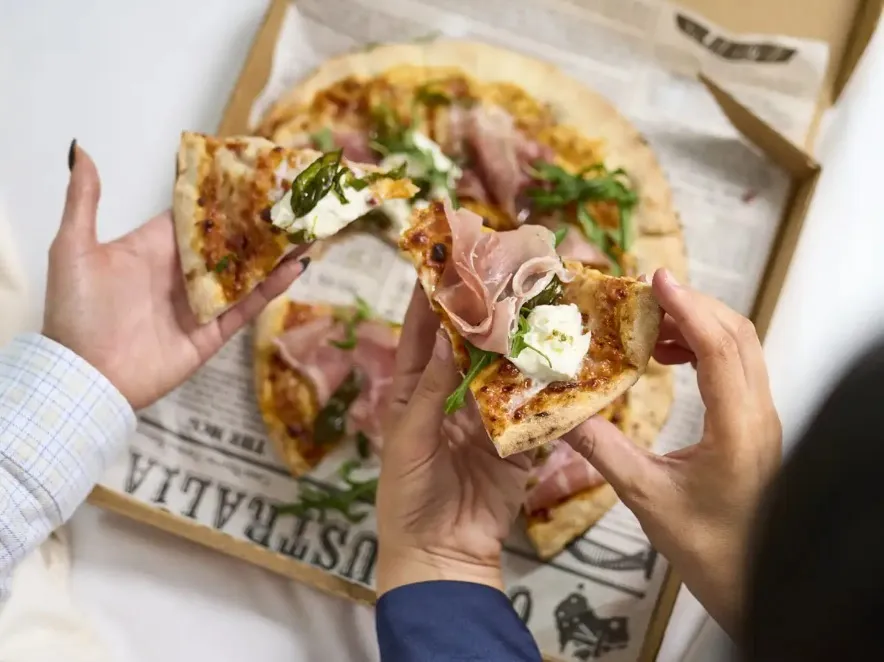 In-room pizza dining  setup at Dorsett Melbourne