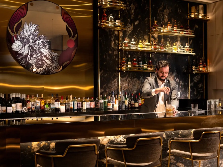 Bartender serving drinks at Jin Bar, Dorsett Melbourne