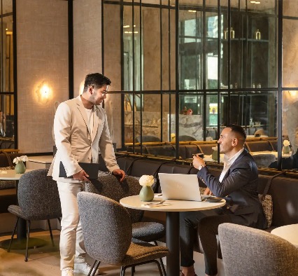 Staff serving guests at Dorsett Melbourne Club Lounge