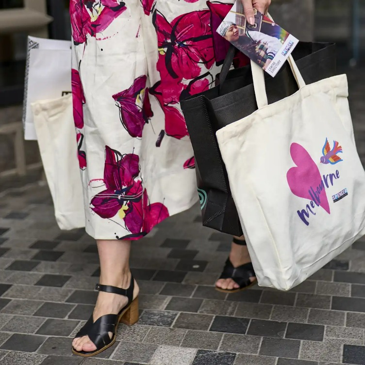 Walking woman holding shopping bags