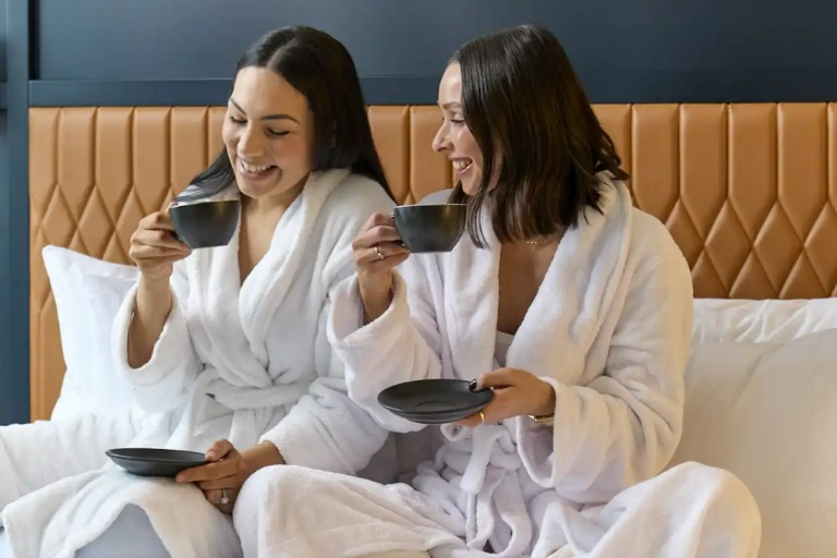 Ladies having in-room coffee at Dorsett Melbourne