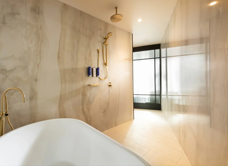 Bathroom with a tub at Dorsett Melbourne Balcony Suite