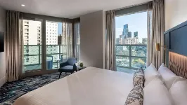 King-size balcony suite bed at Dorsett Melbourne