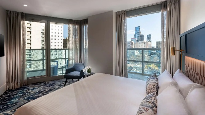 King-size balcony suite bed at Dorsett Melbourne