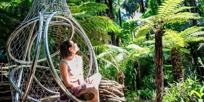 Woman sitting in the Royal Botanic Gardens Victoria