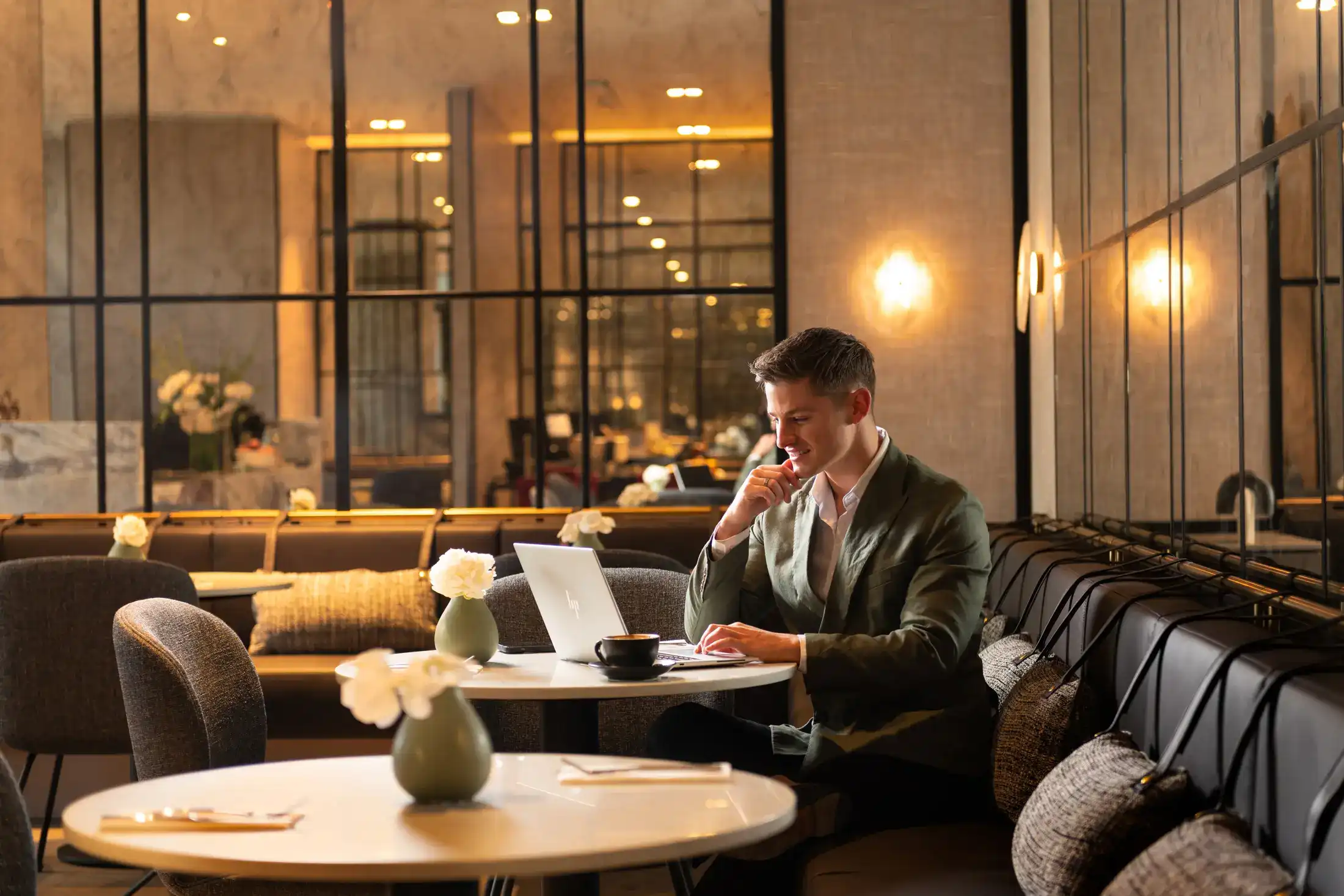 Hotel guest working on a laptop